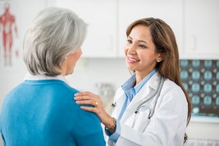 doctor speaking with patient